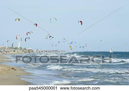 Kitesurfing competition at beach View Large Photo Image Stock Image - Kitesurfing competition at beach. Fotosearch
