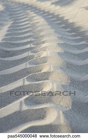 Tire track on sand, close-up View Large Photo Image Stock Photo - Tire track on sand, close-up. Fotosearch