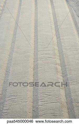 Tire track on sand, close-up View Large Photo Image Stock Photograph - Tire track on sand, close-up. Fotosearch