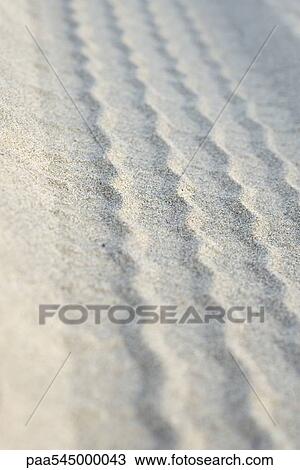 Stock Image - Tire track on sand. Fotosearch