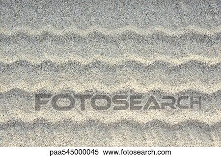 Stock Photography - Tire tracks on sand, close-up. Fotosearch