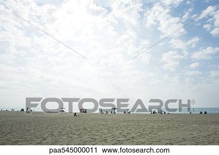 Vacationers on beach View Large Photo Image Stock Image - Vacationers on beach. Fotosearch
