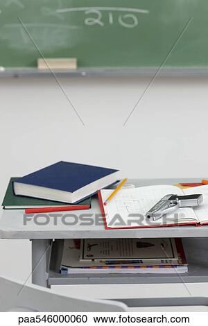 Handgun lying on top of school desk View Large Photo Image Stock Image - Handgun lying on top of school desk. Fotosearch
