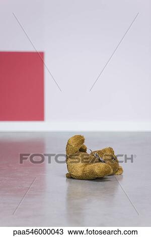 Teddy bear left lying on floor View Large Photo Image Stock Image - Teddy bear left lying on floor. Fotosearch
