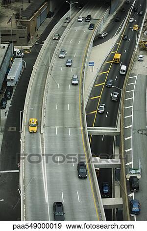 "Elevated freeway, busy city streets" View Large Photo Image Stock Photo - "Elevated freeway, busy city streets". Fotosearch