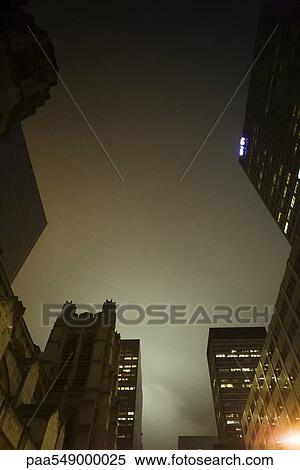 "Foggy night view of high rise buildings, church" View Large Photo Image Stock Photography - "Foggy night view of high rise buildings, church". Fotosearch