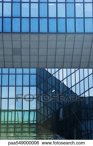 Stock Photograph - Glass facade of office building. Fotosearch