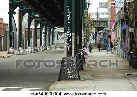 Graffiti on support column of elevated road View Large Photo Image Picture - Graffiti on support column of elevated road. Fotosearch