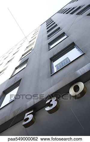 "High risde building address, low angle view" View Large Photo Image Stock Image - "High risde building address, low angle view". Fotosearch