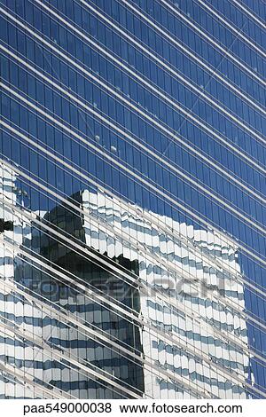 "Reflection of building on widows of steel and glass high rise office building, cropped" View Large Photo Image Stock Photo - "Reflection of building on widows of steel and glass high rise office building, cropped". Fotosearch