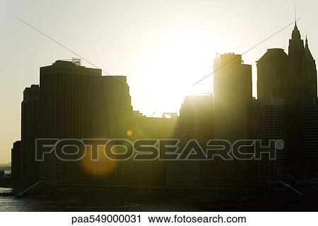 Silhouette of city skyline at sunset View Large Photo Image Stock Image - Silhouette of city skyline at sunset. Fotosearch