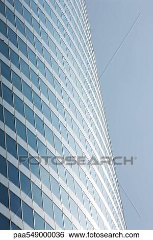 Stock Photograph - "Steel and glass facade of high rise office building, cropped". Fotosearch