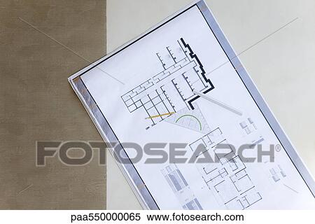 Stock Photography - Blueprint spread out on floor. Fotosearch