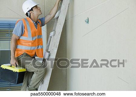 Man climbing ladder carrying toolbox View Large Photo Image Stock Photo - Man climbing ladder carrying toolbox. Fotosearch