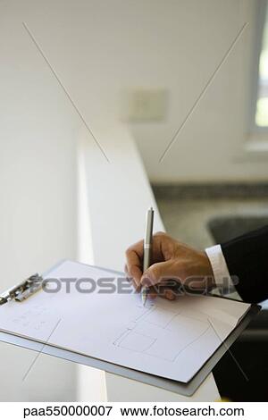 Person drawing on clipboard pad View Large Photo Image Stock Photo - Person drawing on clipboard pad. Fotosearch