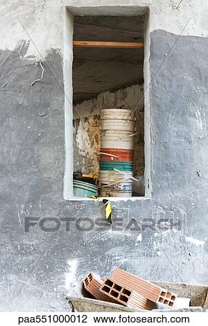 "Construction site, bricks in wheelbarrow, stack of buckets in unfinished room" View Large Photo Image Stock Image - "Construction site, bricks in wheelbarrow, stack of buckets in unfinished room". Fotosearch