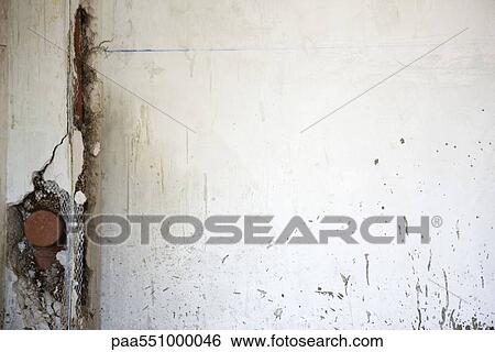 Cracked wall exposing plumbing fixture View Large Photo Image Stock Photograph - Cracked wall exposing plumbing fixture. Fotosearch