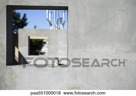 Stock Photo - Masonry trowel set on window ledge. Fotosearch