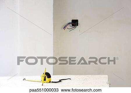 "Measuring tape, pencil on table in unfinished room" View Large Photo Image Stock Image - "Measuring tape, pencil on table in unfinished room". Fotosearch