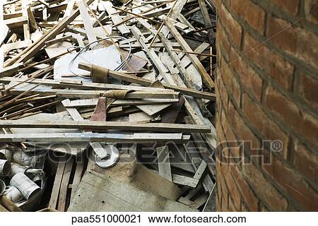 "Pile of demolition debris, wood, pipe, wires next to brick wall" View Large Photo Image Stock Image - "Pile of demolition debris, wood, pipe, wires next to brick wall". Fotosearch