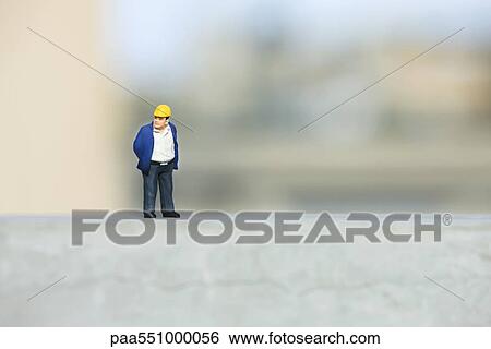 Plastic figurine of construction worker set on ledge View Large Photo Image Stock Photograph - Plastic figurine of construction worker set on ledge. Fotosearch