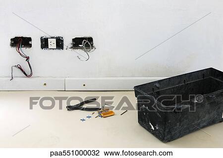 "Plastic toolbox, pliers on floor near unfinished electrical sockets" View Large Photo Image Stock Image - "Plastic toolbox, pliers on floor near unfinished electrical sockets". Fotosearch