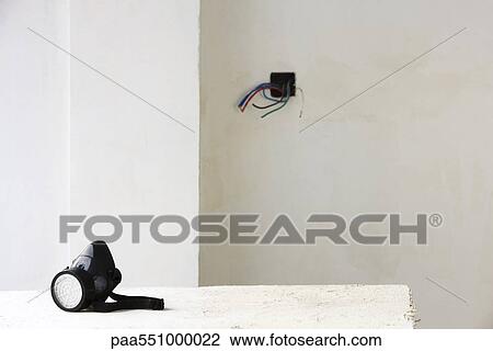 Safety mask on table in unfinished room View Large Photo Image Stock Image - Safety mask on table in unfinished room. Fotosearch