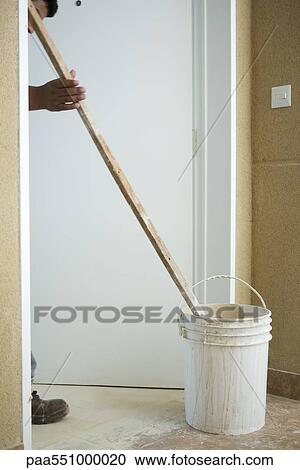 Worker mixing bucket of plaster View Large Photo Image Stock Image - Worker mixing bucket of plaster. Fotosearch
