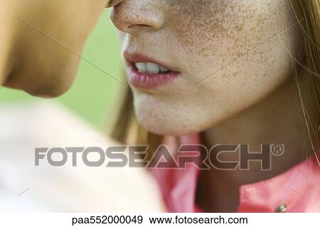 "Young couple face to face, touching noses, cropped" View Large Photo Image Stock Photo - "Young couple face to face, touching noses, cropped". Fotosearch
