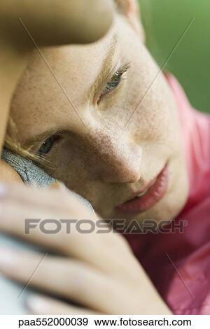 "Young woman resting head on man's chest, looking away" View Large Photo Image Stock Photo - "Young woman resting head on man's chest, looking away". Fotosearch