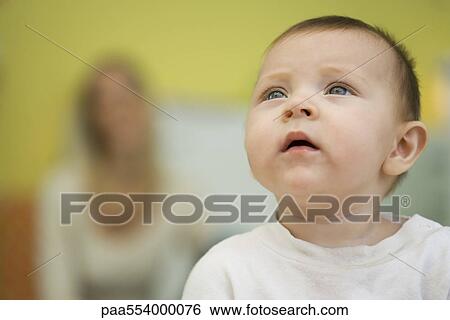 Stock Photograph - Baby looking up. Fotosearch