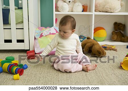 Stock Photo - Baby playing in nursery. Fotosearch
