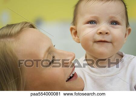 Mother comforting crying baby, close-up View Large Photo Image Stock Image - Mother comforting crying baby, close-up. Fotosearch