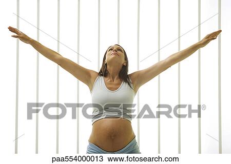 Pregnant woman doing stretches View Large Photo Image Stock Image - Pregnant woman doing stretches. Fotosearch