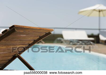 Poolside deckchair View Large Photo Image Stock Photo - Poolside deckchair. Fotosearch