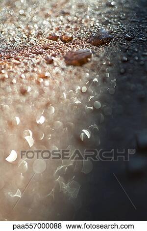 Stock Photo - Water droplets on rocky surface, close-up. Fotosearch