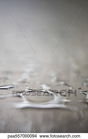 Water droplets on surface, extreme close-up View Large Photo Image Picture - Water droplets on surface, extreme close-up. Fotosearch