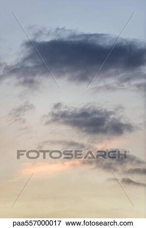 Stock Photo - Wispy clouds at sunset. Fotosearch