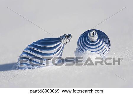 Christmas ornaments on snow View Large Photo Image Stock Photo - Christmas ornaments on snow. Fotosearch