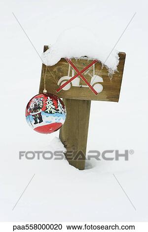 Decorative Christmas ornament hanging from snow-covered sign prohibiting driving golf cart in area View Large Photo Image Stock Image - Decorative Christmas ornament hanging from snow-covered sign prohibiting driving golf cart in area. Fotosearch