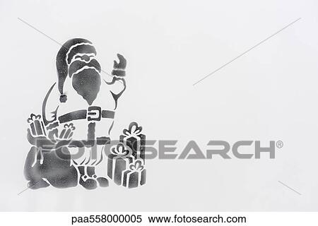 Stock Photography - Santa Claus image stenciled on frosted glass. Fotosearch