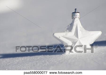 Star Christmas ornament in snow View Large Photo Image Stock Photo - Star Christmas ornament in snow. Fotosearch