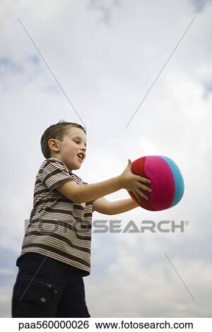 Little boy catching ball View Large Photo Image Stock Photograph - Little boy catching ball. Fotosearch