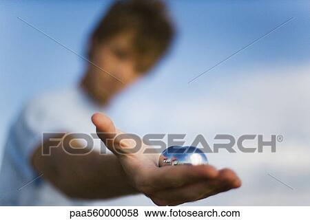 Man holding yin yang balls in hand, close-up View Large Photo Image Stock Photo - Man holding yin yang balls in hand, close-up. Fotosearch