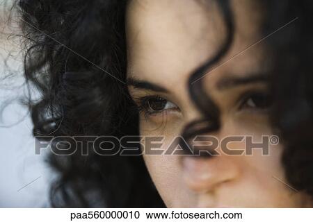 Young woman looking away, close-up View Large Photo Image Stock Image - Young woman looking away, close-up. Fotosearch