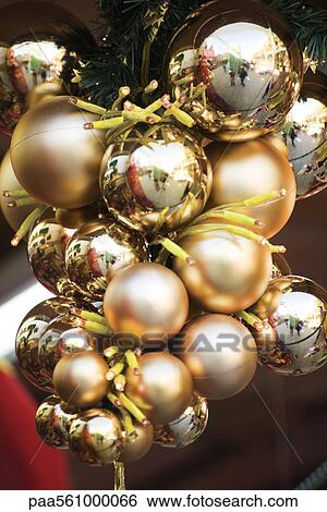 Stock Photograph - Golden Christmas ornaments. Fotosearch