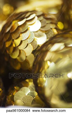 Picture - Golden sequined Christmas ornaments. Fotosearch
