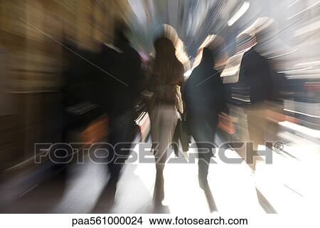 Picture - Pedestrians walking, rear view, blurred. Fotosearch