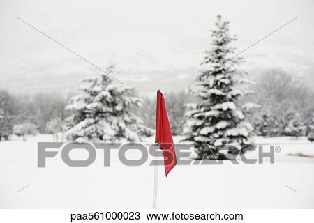Red flag on snow-covered golf course View Large Photo Image Stock Image - Red flag on snow-covered golf course. Fotosearch