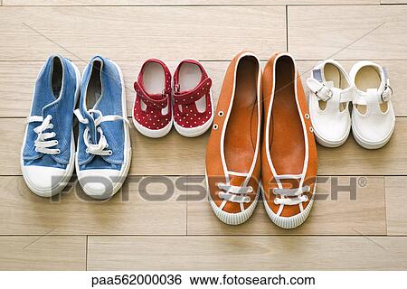 Family's shoes lined up together View Large Photo Image Stock Photograph - Family's shoes lined up together. Fotosearch